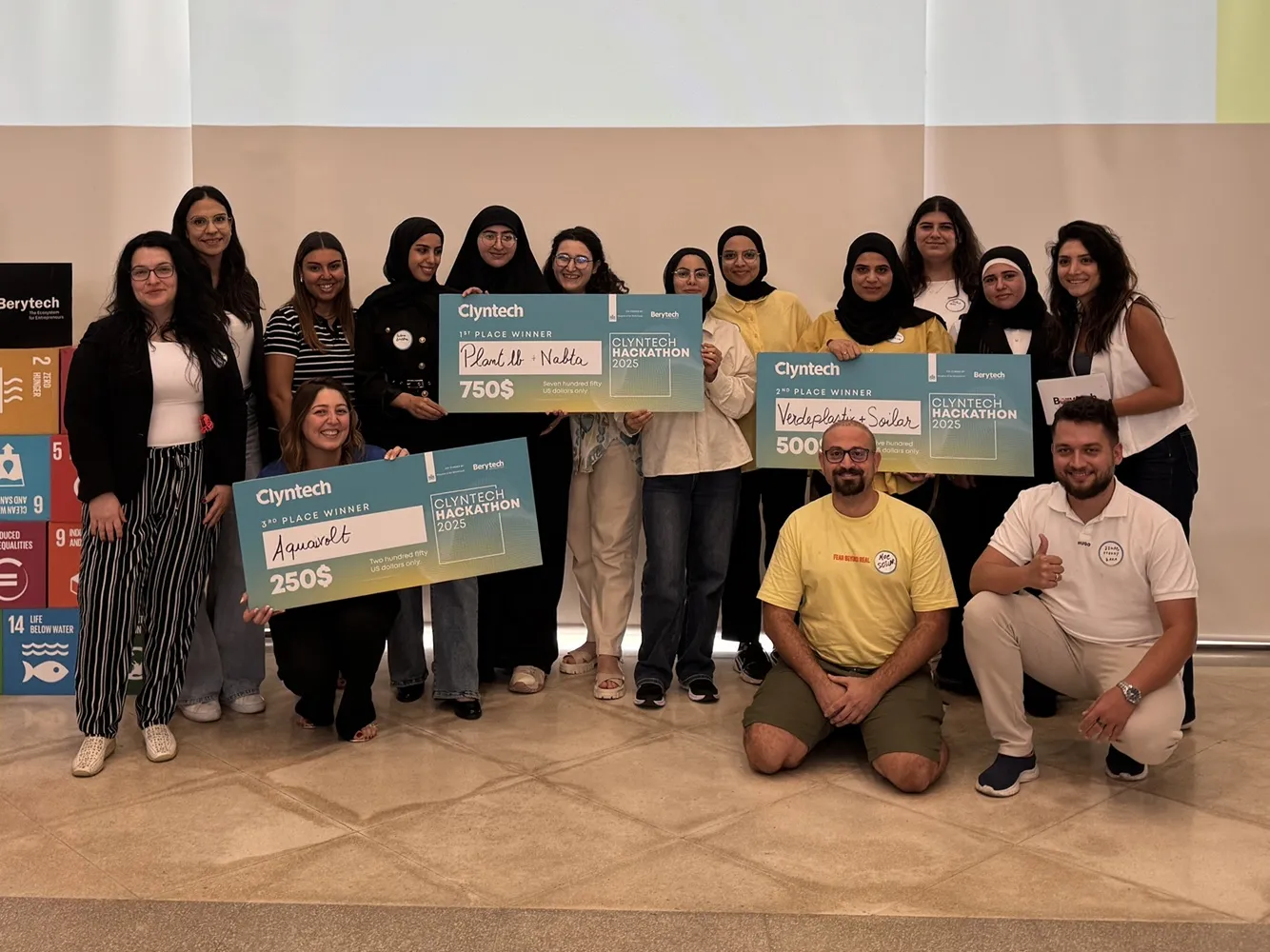Clyntech Hackathon 2025 winners with Berytech, holding first, second and third place prize cheques